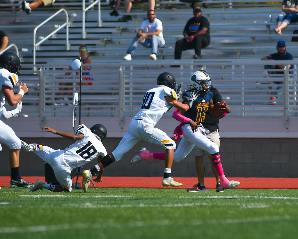 Battle quarterback Khaleel Dampier carries the ball down the sideline